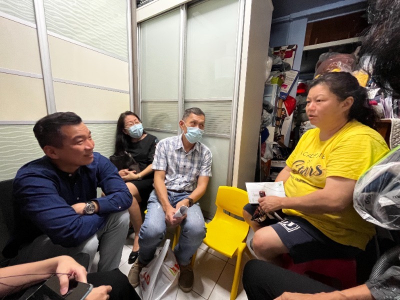 Mr Chua with church volunteer Roy Tay and Mdm Tan during the befriending session