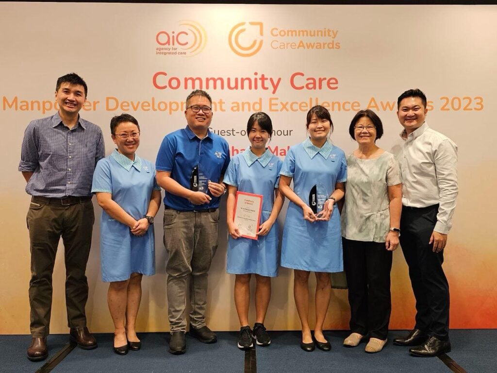 MWS Home Care & Home Hospice team including CCEA recipients Yeo Chee Wei (3rd from left), Poh Chu Xiang (centre) and Chong Yan Chew (3rd from right) at the Community Care Manpower Development & Excellence Awards 2023