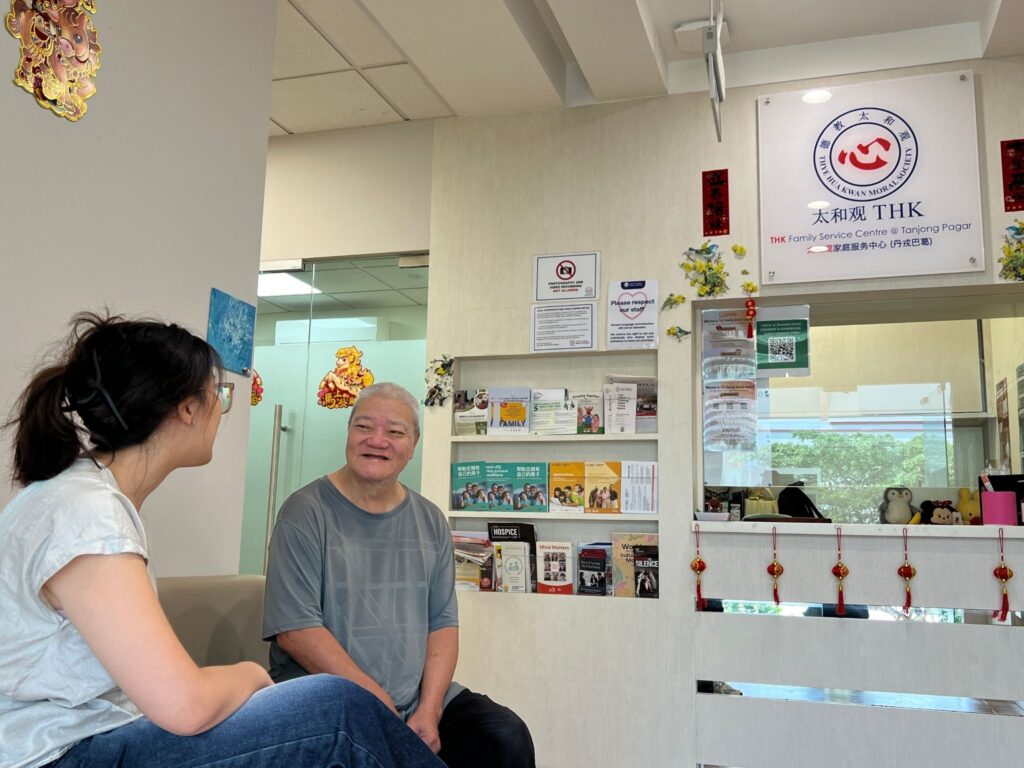 Woo Hong Liang, a beneficiary of Thye Hwa Kwan Moral Charities, with his social worker Eva Lui.