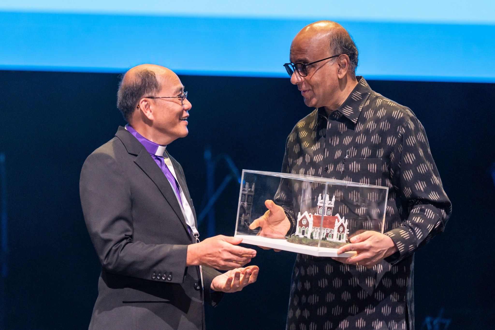Bishop Philip Lim, spiritual head of MCS, presenting a model of Wesley Methodist Church – the first Methodist church in Singapore – to President Tharman