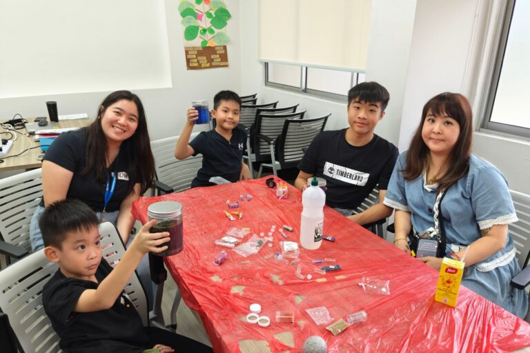 MWS social worker, Olivia (far left), guiding participants to create a self-regulation tool