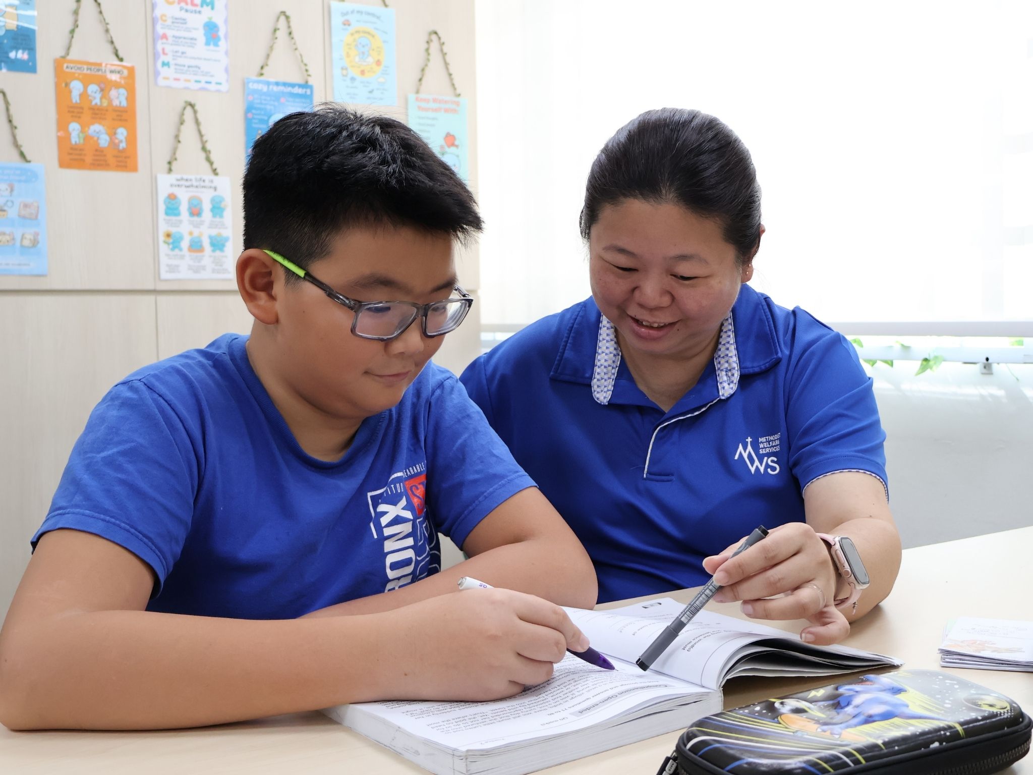 “Over the years, Xodus has become much more willing 
to open his heart and let others into his inner world,” 
observed his teacher, Winnie, pictured here with Xodus