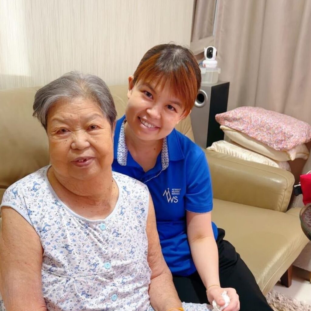 Ker Sin with Ah Kim, a beneficiary of MWS Home Care & Home Hospice