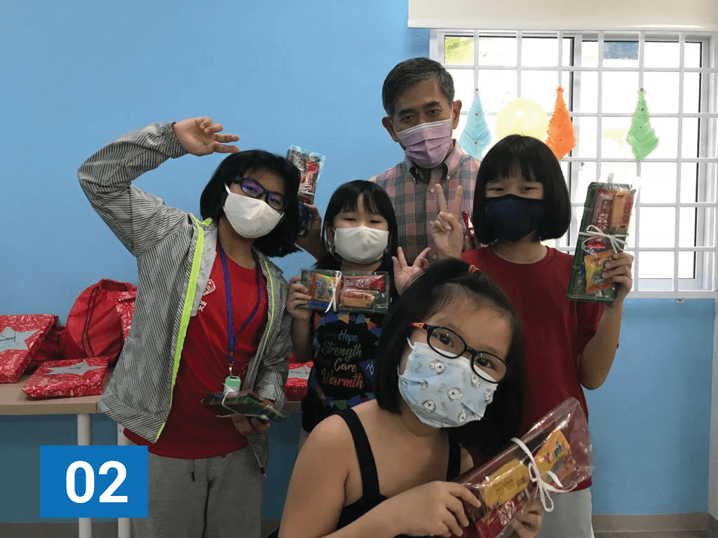 MWS Board Member Terence Wee enjoying a fun moment with the children at the Centre